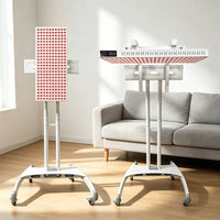 Red light therapy panels on adjustable stands in a bright living room for at-home wellness