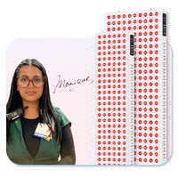 Woman with glasses and name badge next to LED red light therapy panels