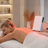 Woman lying face down while the YA60-2W7 panel is positioned for targeted red light therapy on her upper back