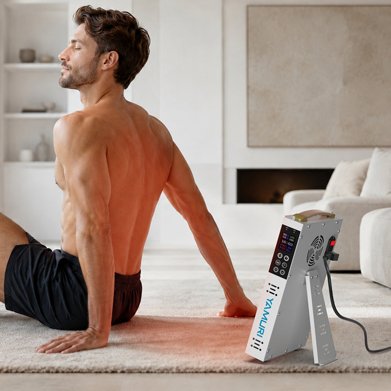 Man seated with his back toward the YA60-2W7 panel during a targeted at-home red light therapy session